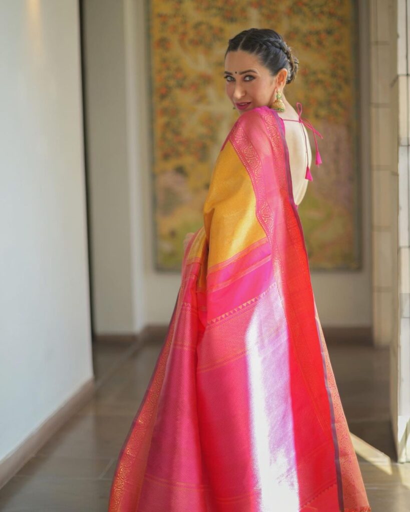 Karishma Kapoor in yellow and pink saree with deep neck blouse and braided hairstyle - hairstyle for thin girls