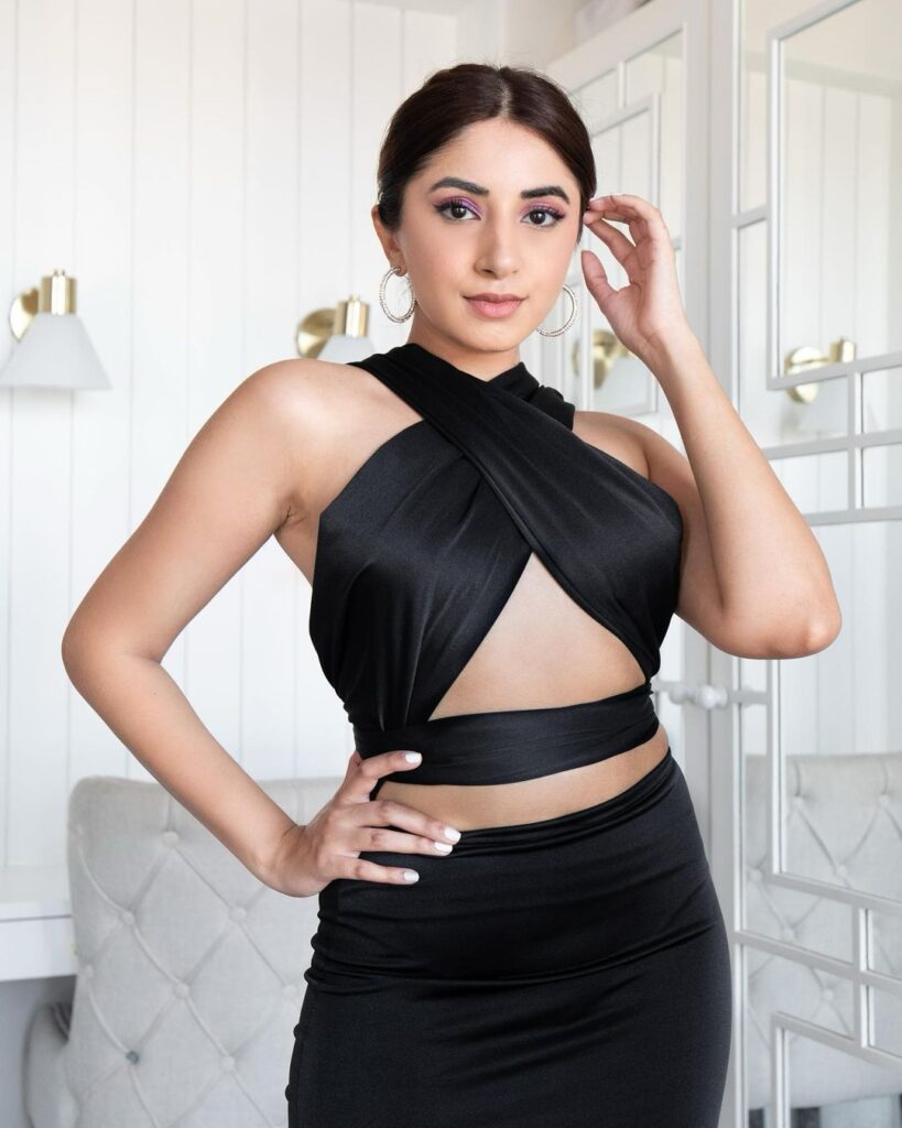 Aashna Shroff in black stunning dress with sleek and tight bun - face shape