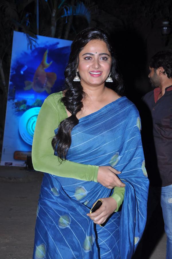 Anushka Shetty in blue saree and green blouse with braided hairstyle - hairstyle for curly hair