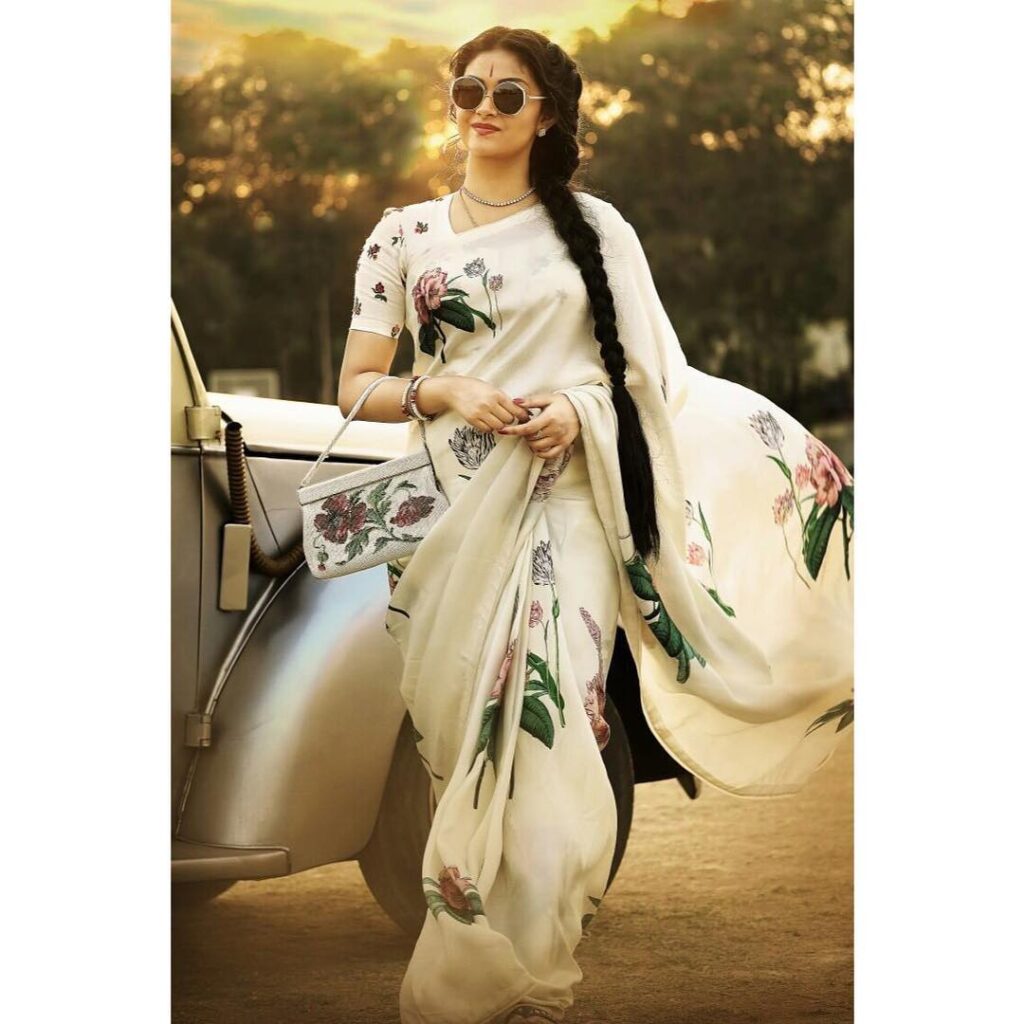 Keerthy Suresh in white floral printed saree with long braid - hairstyle for long hair