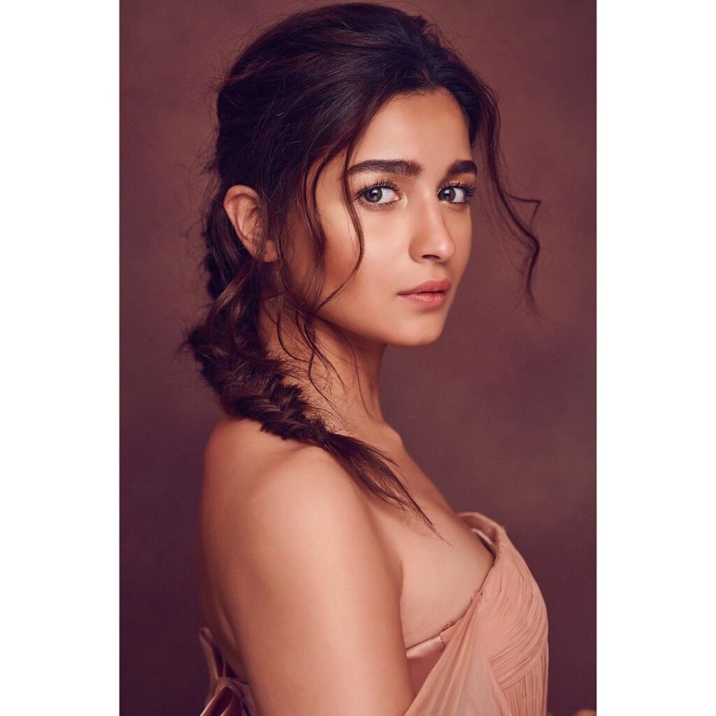 Alia Bhatt in pink off shoulder and  braid with bangs hairstyle posing for camera - long hair