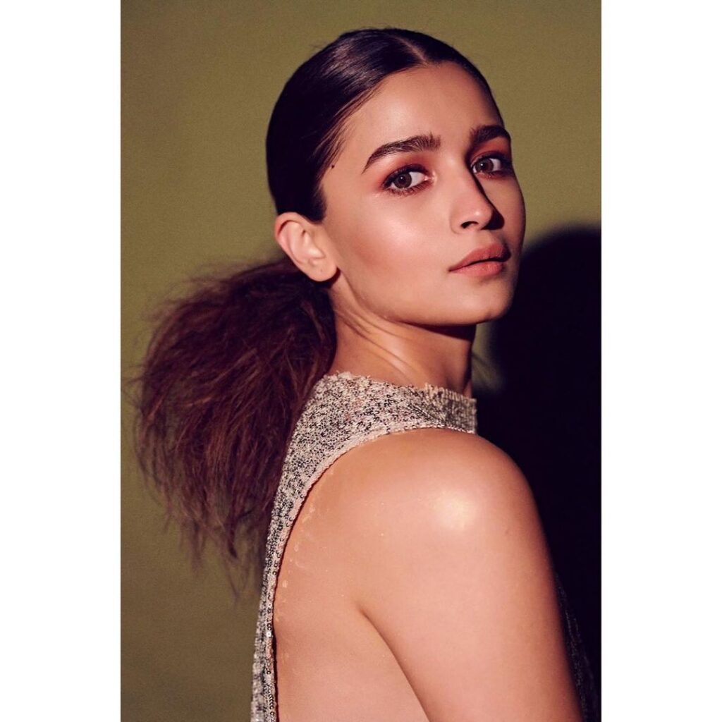 Alia Bhatt in silver deep cut dress and Center parted messy ponytail - professional hairstyles