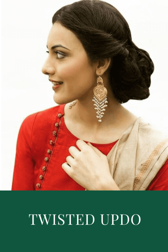 A girl in red kurta and danglers showing the side view of her low twisted bun - hair color
