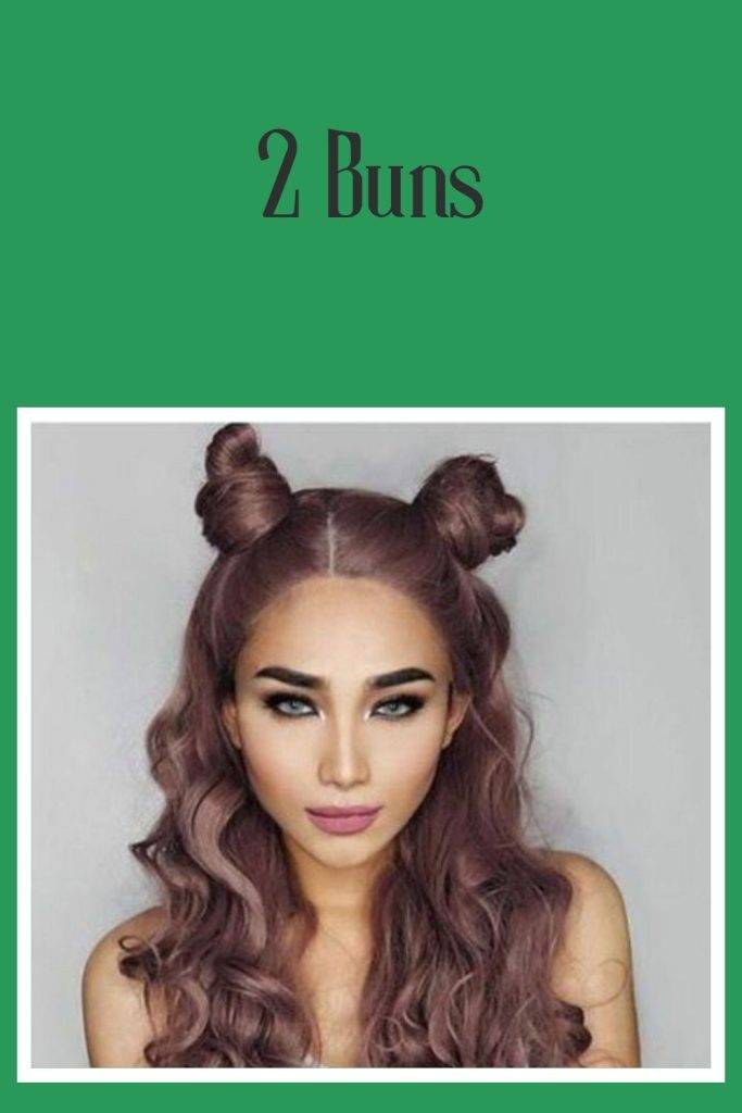A girl with smoky eye makeup showing her 2 buns hairstyles - 40s women hairstyles
