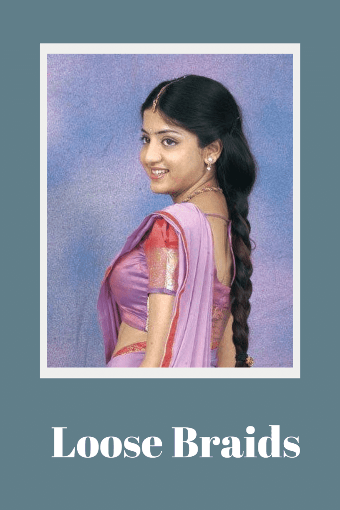A smiling girl in saree and loose braid - braided hairstyles