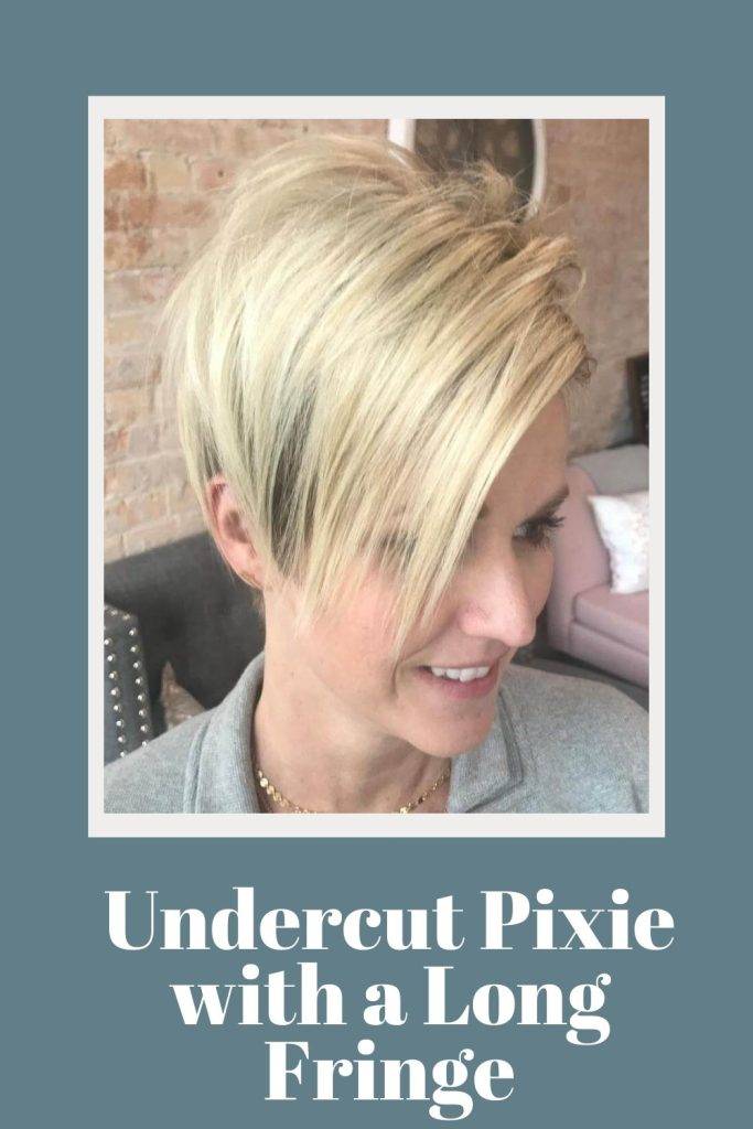 A girl in grey top showing the side view of her Undercut Pixie with a Long Fringe - trending hair color