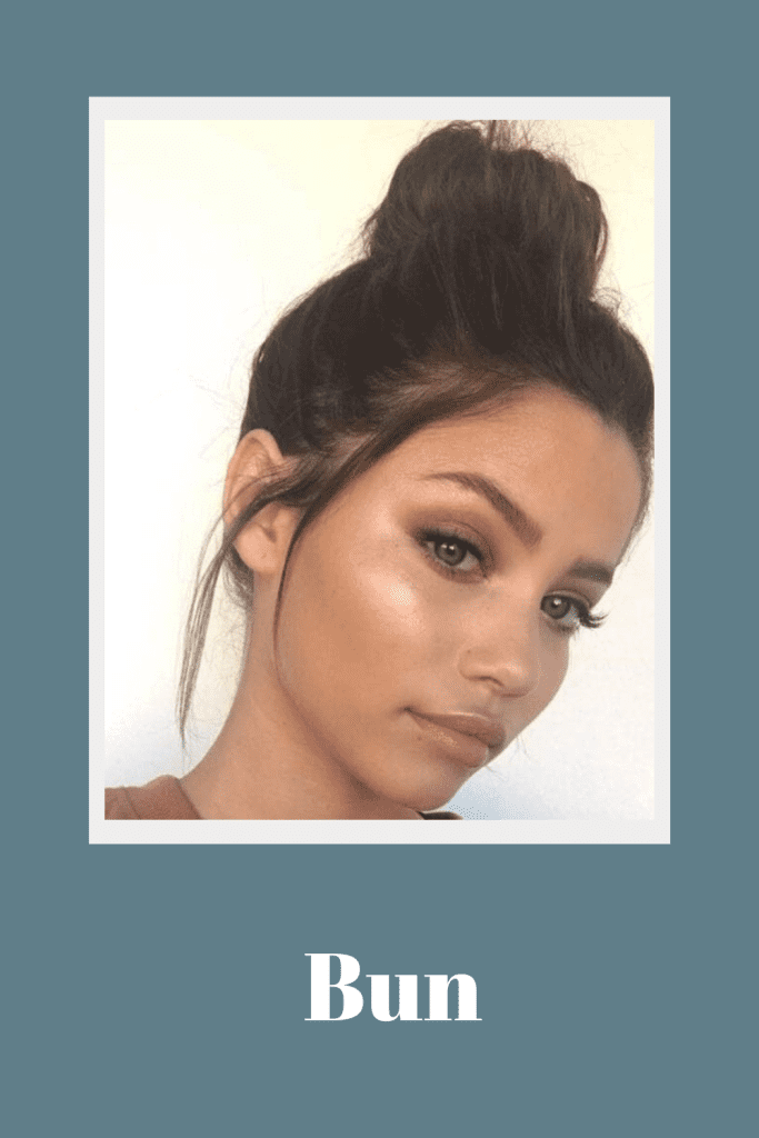 A girl in brown top and high bun posing for camera - face shape