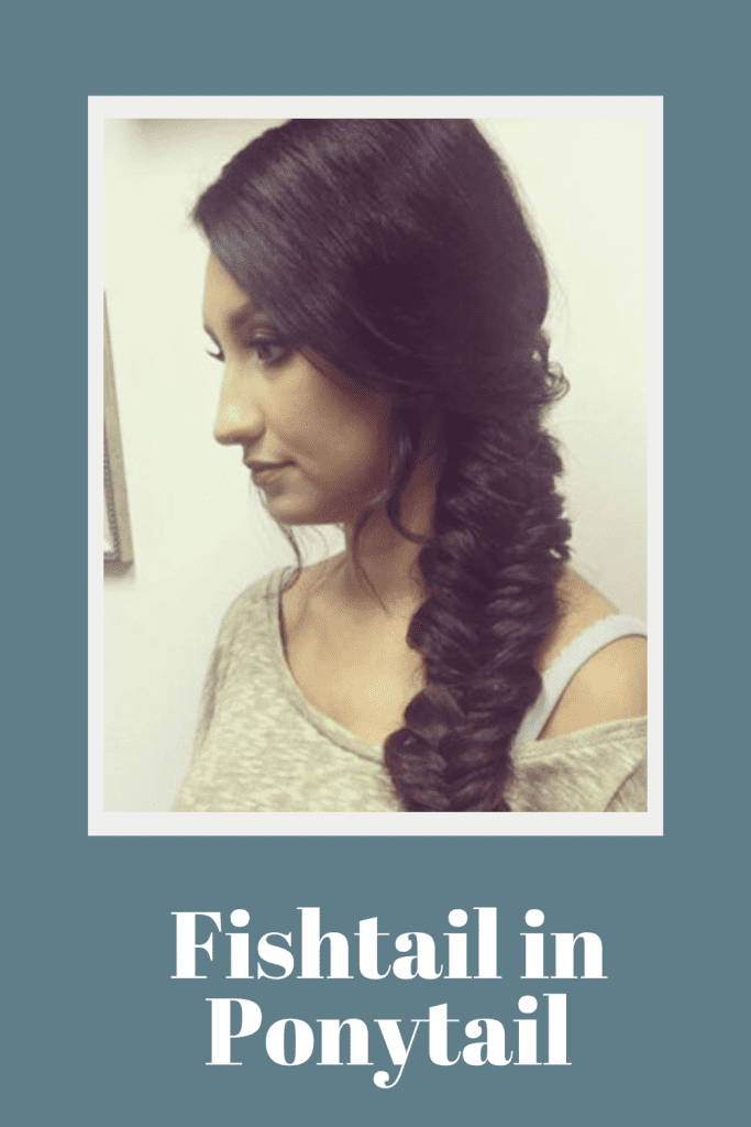 A girl in grey top and fishtail in ponytail hairstyle - braided hairstyles