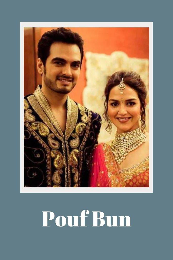 Esha Deol in pink lehenga with heavy jewellery posing for camera with her husband - wedding hairstyles 
