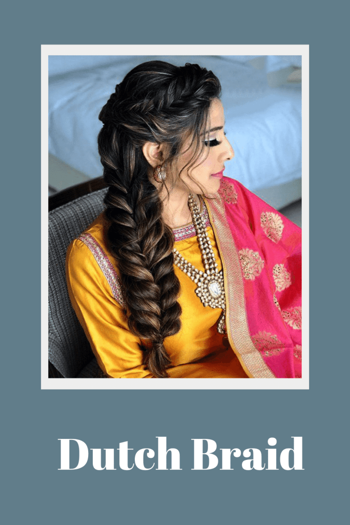 A girl in yellow and pink suit showing the side view of her dutch braid - long hair hairstyles