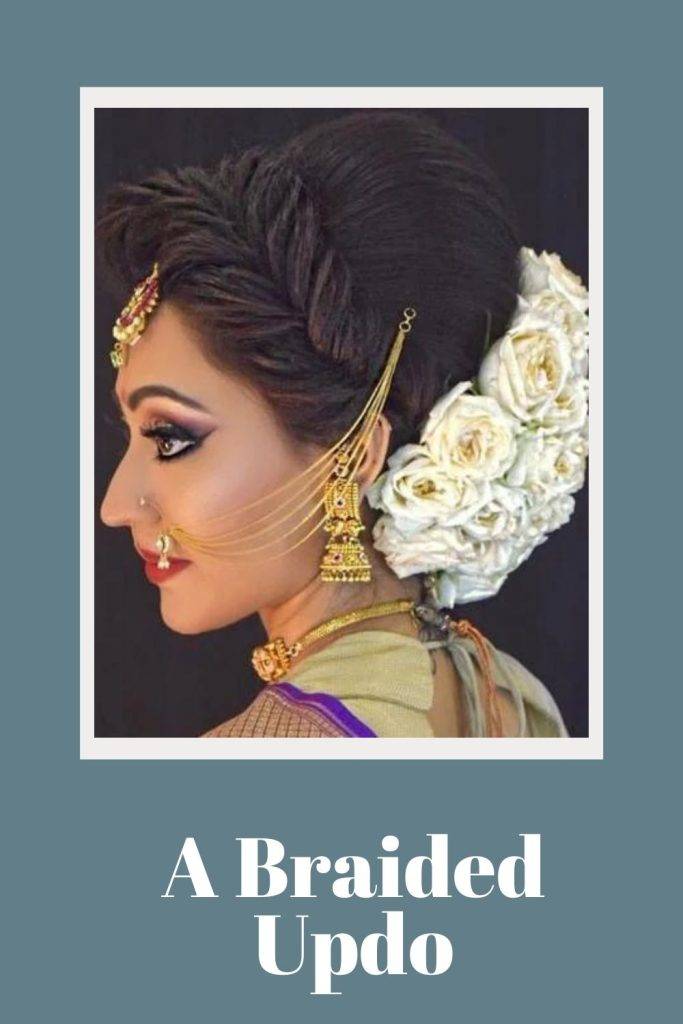 A girl with heavy jewellery and A braided updo - soft curls bridal hairstyle