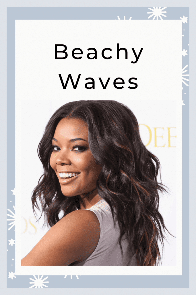 A smiling girl in off white cut sleeves top showing her Beachy Waves hairstyle - hairstyles for women
