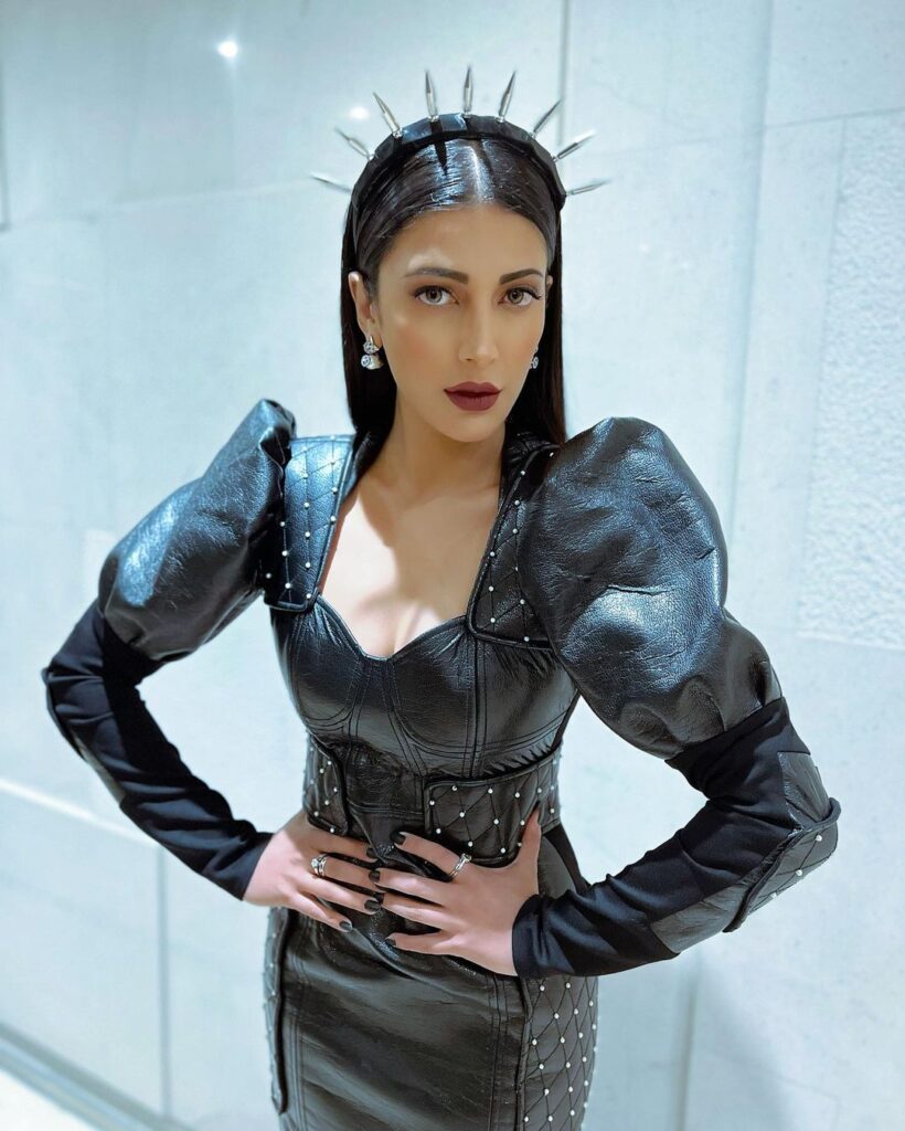 Shruti Haasan in black leather dress with straight hair with accessories - hairstyles for tall girls