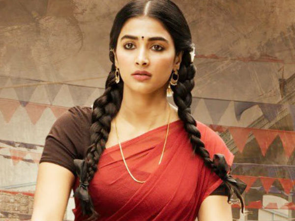 Pooja Hegde in red saree with brown blouse showing her pigtails - oval face shape
