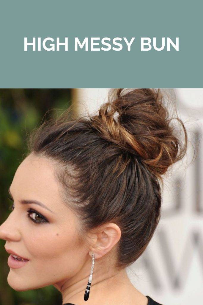 A girl posing for camera and showing her the side view of her high messy bun - hairstyles to look hair thick