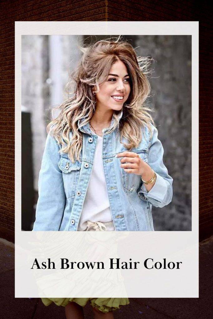 A girl in sky blue denim jacket and white inner showing her Ash Brown Hair Color - skin tone