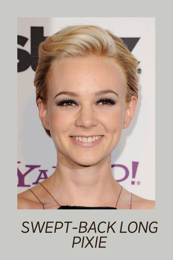 A smiling girl in black sleeveless dress posing for camera and showing Swept-back long Pixie hairstyle - hairstyles for short hair