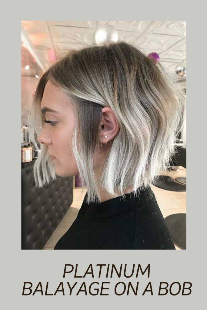 A girl in black high neck top showing the side view of her Platinum Balayage On A Bob - hairstyles for short hair