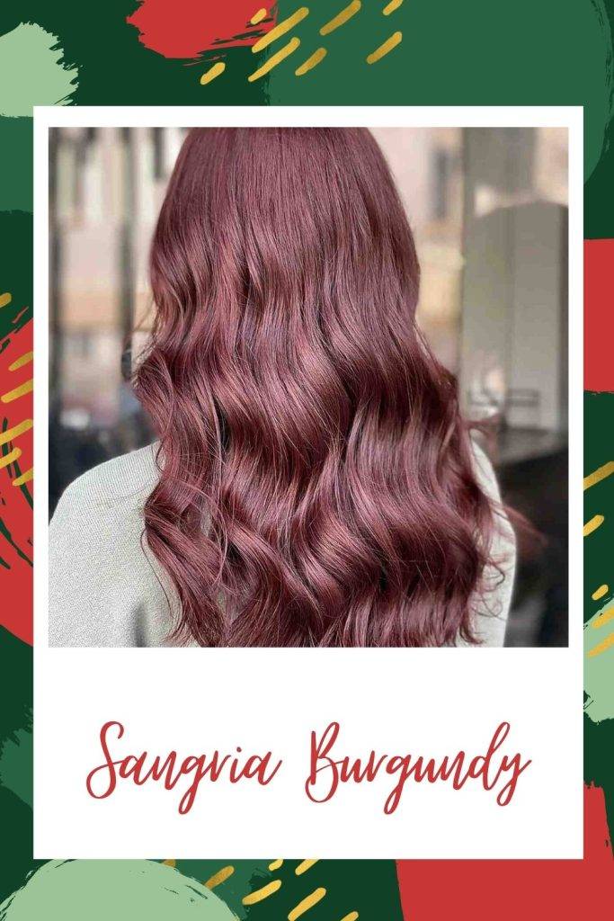 A girl in grey top showing the side view of her Sangria burgundy hair color - burgundy hair color highlights