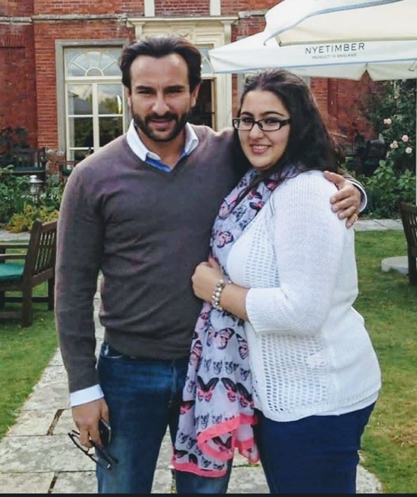 Sara Ali Khan in white top and stole posing for camera with his father Saif Ali Khan - celebrities weight loss secrets 