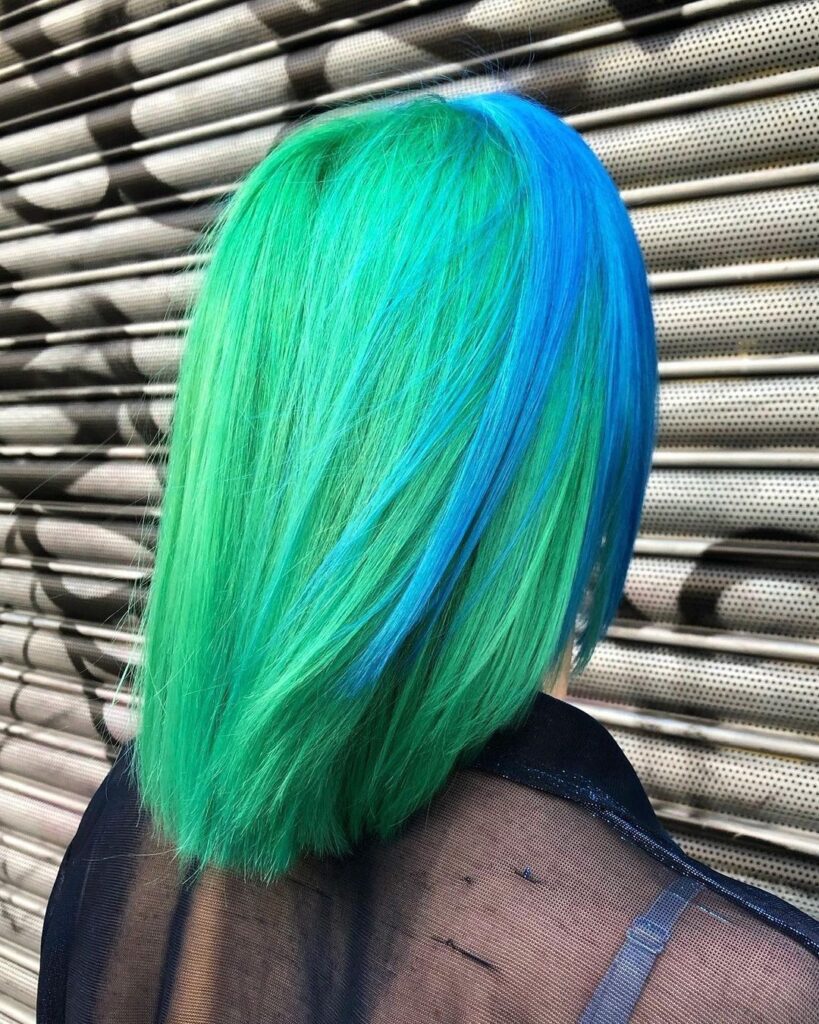 A girl showing the back side of her 4.	Pastel Mermaid hair color - green hair color ideas