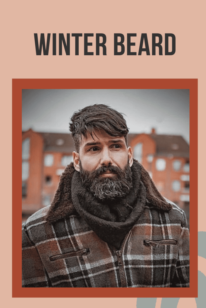 A man in heavy winter dress posing for camera and showing his winter beard - beard styles