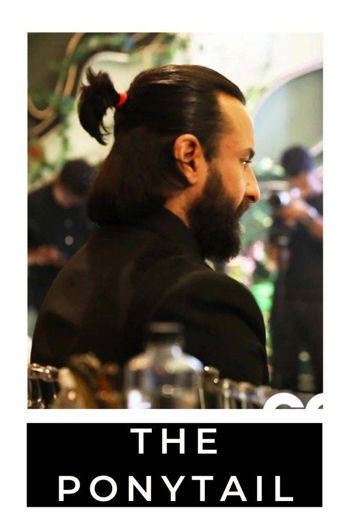 Saif Ali Khan in black suit showing the side view of his ponytail look - saif ali khan in suit