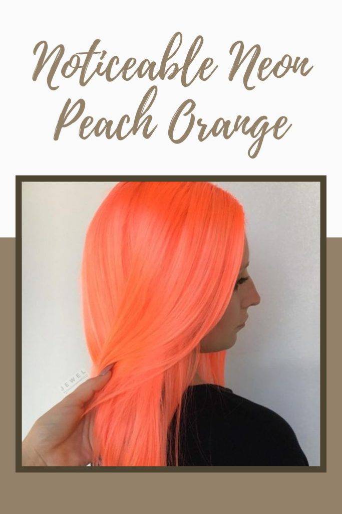 A girl in black t-shirt showing her 	Noticeable neon peach Orange hair color - funky hair colours