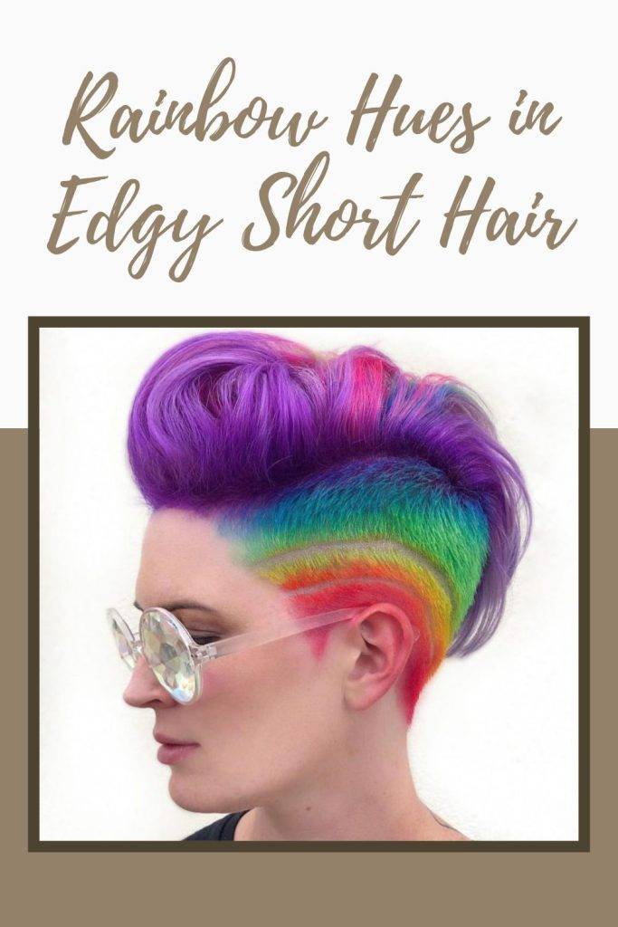 A girl in goggles showing the side view of her rainbow hues in edgy short hair - long hair