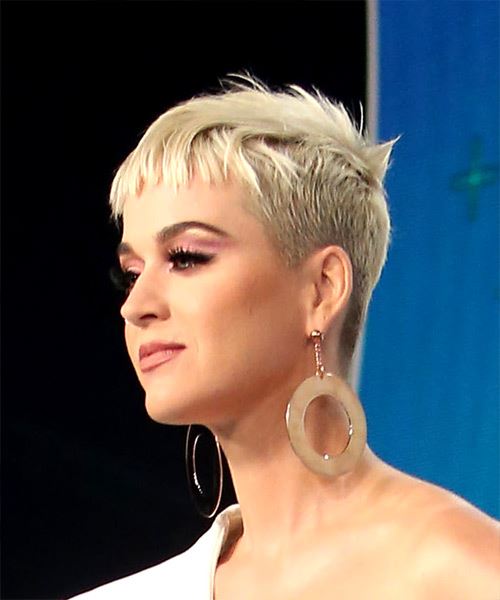 Katy Perry in one shoulder white dress with danglers posing for camera and showing her shaggy pixie cut - hollywood actresses short hair