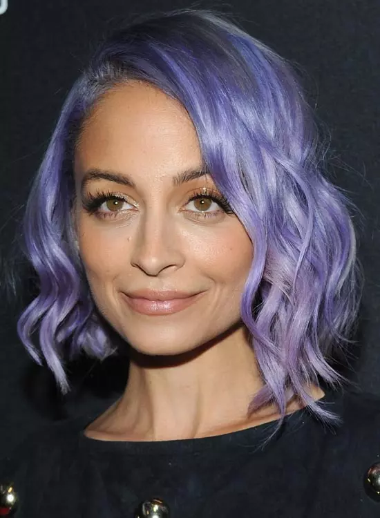 Nicole Richie in black dress posing for camera and showing her purple hair with chic hairdo - hollywood actress hairstyle