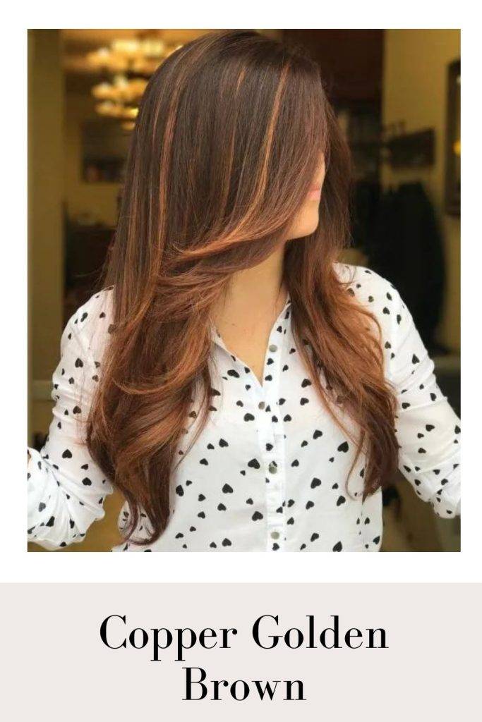 A girl in black and white printed shirt showing the side view of her Copper Golden Brown hair color - golden red hair color