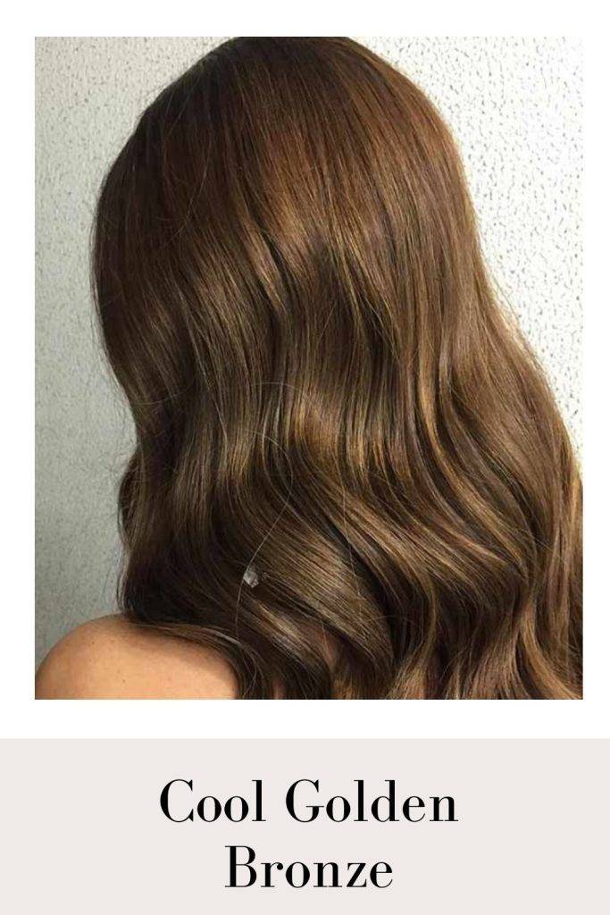A girl showing the back view of her Cool Golden Bronze hair color - golden hair color