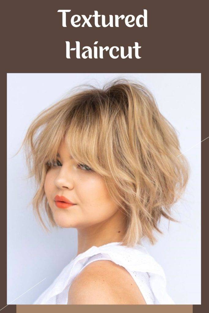 A girl in white cut sleeves top and orange lipstick posing for camera and showing her Textured Haircut - Popular short haircut for women