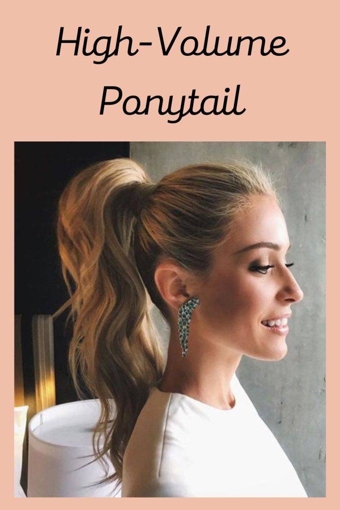 A smiling girl in white top with danglers showing the side view of her High-Volume Ponytail - latest hair cut for girls