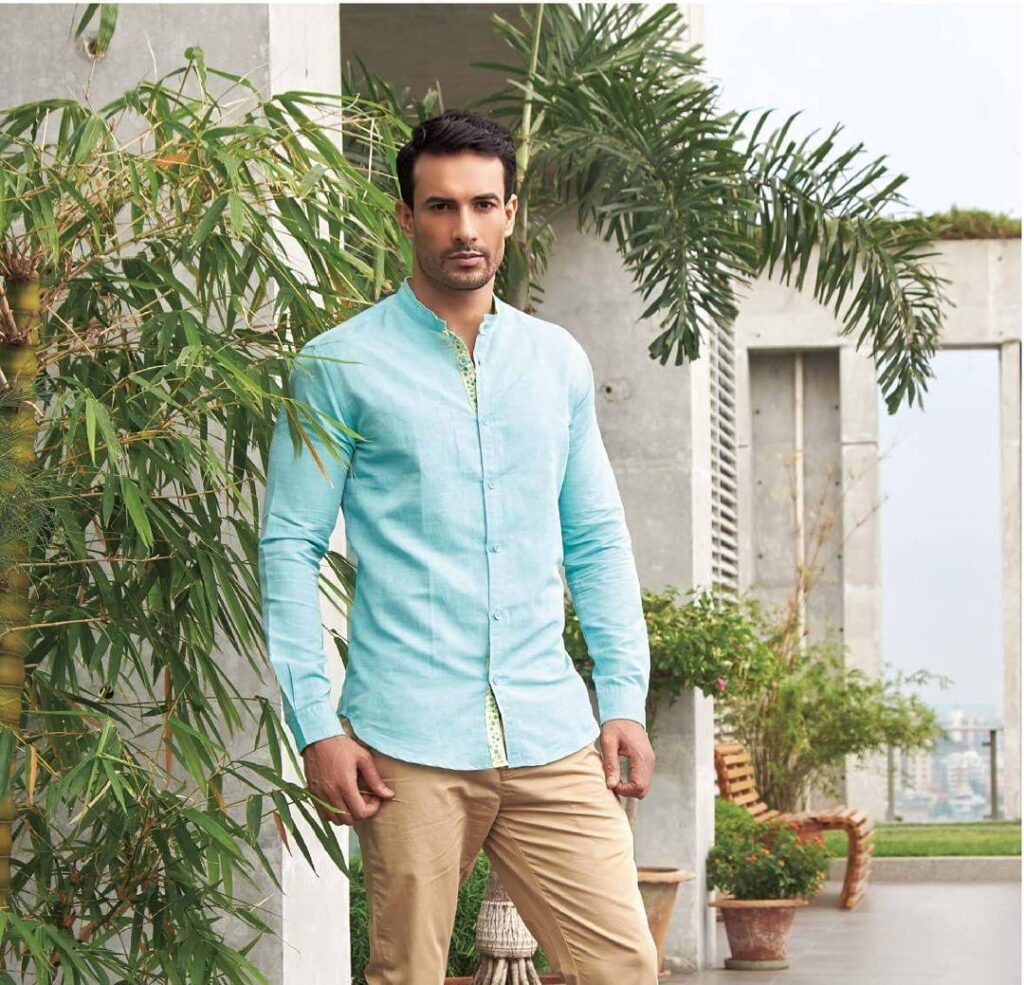 Asif Azim in sky blue shirt with beige pant posing for camera - male models of India