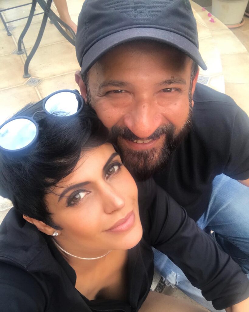 Mandira Bedi and Raj Kaushal in matching black outfit posing for a selfie - Aries compatibility signs