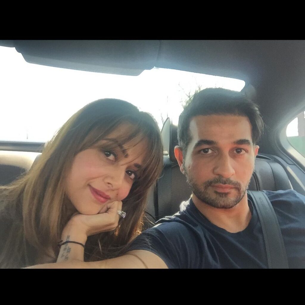 Amrita Arora and Shakeel Ladak sitting in a car and posing for a selfie - Aquarius perfect match