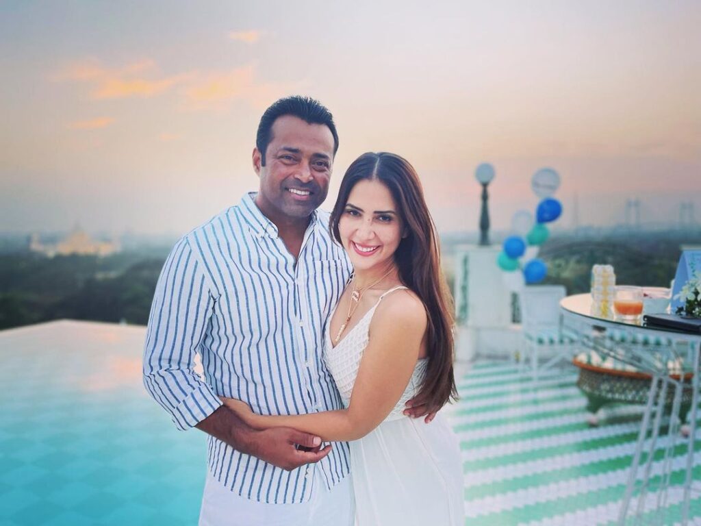 Kim Sharma in white dress and Leander Paes white and blue lining shirt posing for camera - Aquarius compatibility friendship