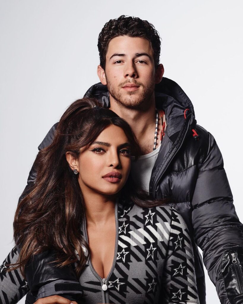 Priyanka Chopra and Nick Jonas in matching grey outfit posing for camera - Cancer best compatibility