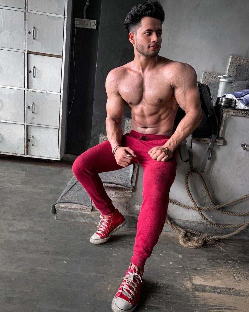 Shirtless Aman Singh Thakur posing for camera in red pants - Models of India