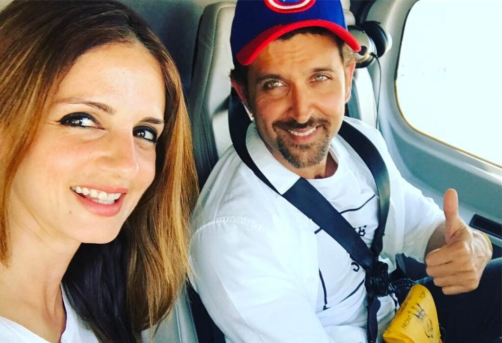 Smiling Hrithik Roshan and Sussanne Khan posing for a selfie in a car - Capricorn compatibility