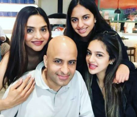 Madhoo and Anand Shah posing for camera with their daughters - best partner for April born