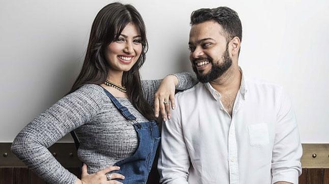 Ayesha Takia in blue dungaree Farhan Azmi in white shirt smiling and posing for camera - best match for Aries