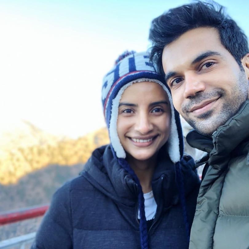 Rajkumar Rao in grey jacket and Patralekha in blue jacket with cap posing for camera - Virgo compatibility for love