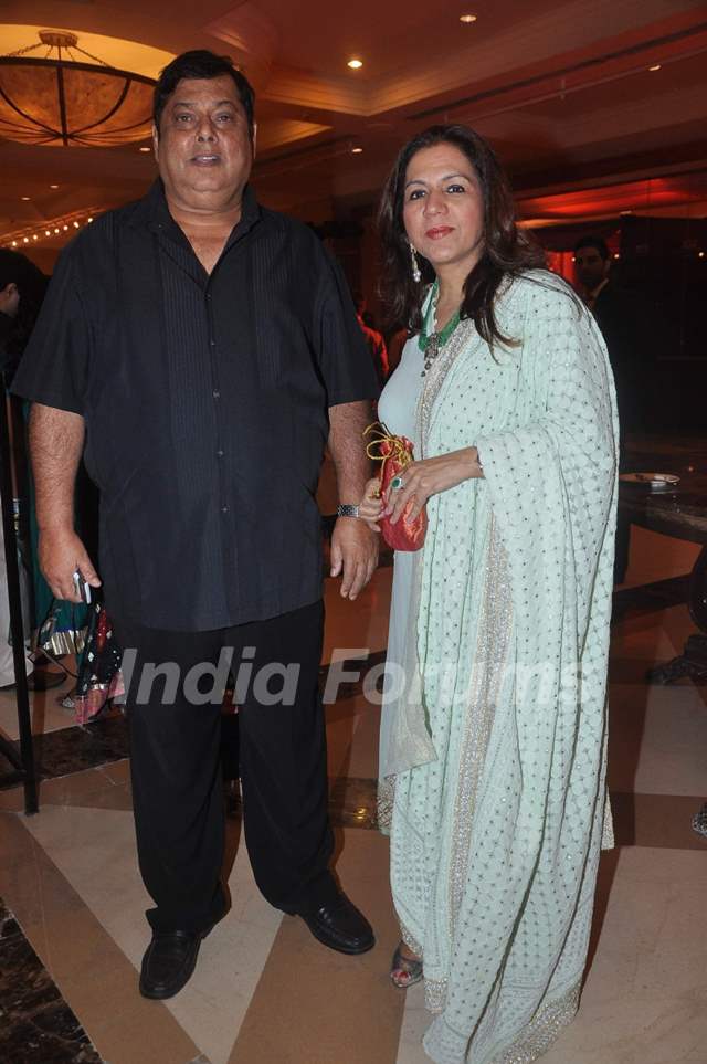 David Dhawan in black pant with shirt and Karuna Dhawan in sky blue suit posing for camera - Leo compatibility for love