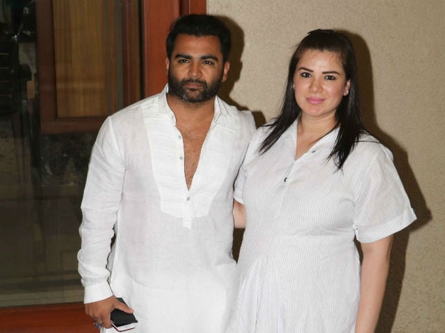 Sachin Joshi and Urvashi Sharma in matching white outfit posing for camera - Leo compatibility signs