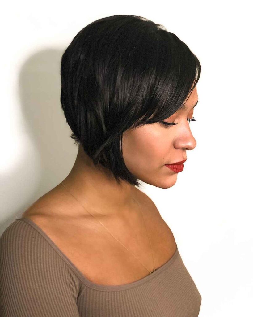Woman in grey square deep neck top and Angled hairstyle - short bob hairstyles