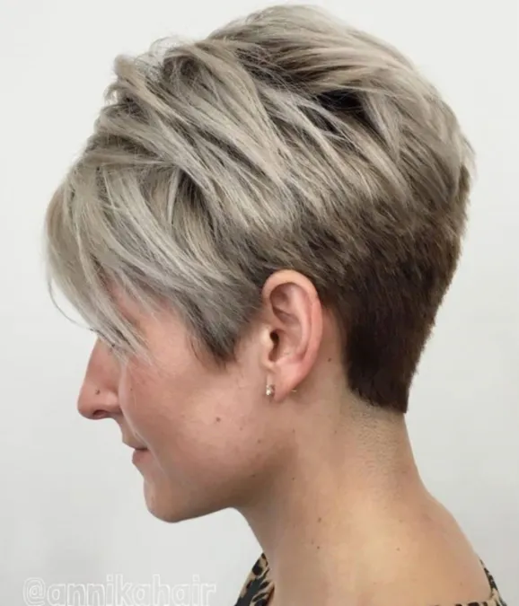 Woman in multicolor dress and stud earrings showing her Two-Tone Pixie haircut - short hairstyles thin hair