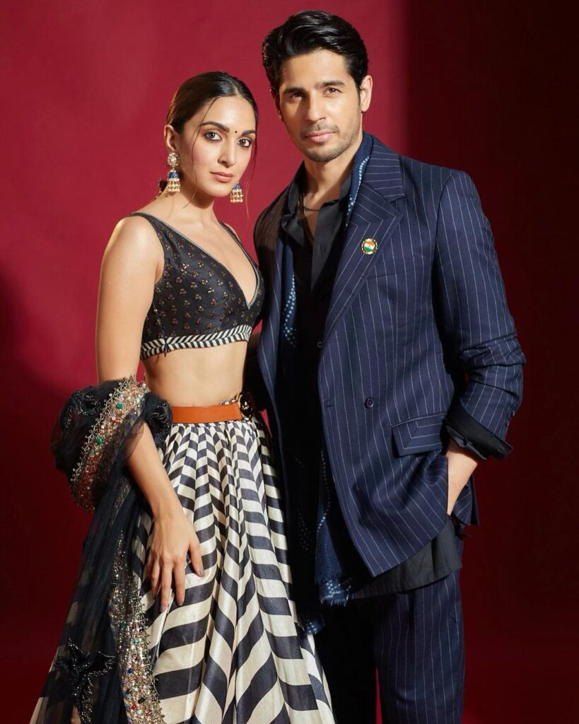 Kiara Advani in black and white lahanga with jhukmkas and Siddharth Malhotra in blur lining suit - Leo compatibility signs